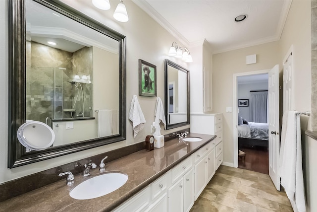 602 Rock Cv, Houston, TX 77079 - full bathroom with double vanity, a shower stall, ensuite bathroom, and ornamental molding