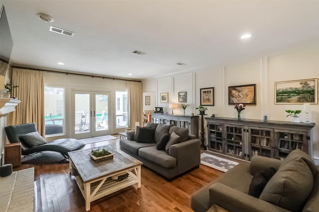 602 Rock Cv, Houston, TX 77079 - living room with french doors, wood finished floors, and recessed lighting