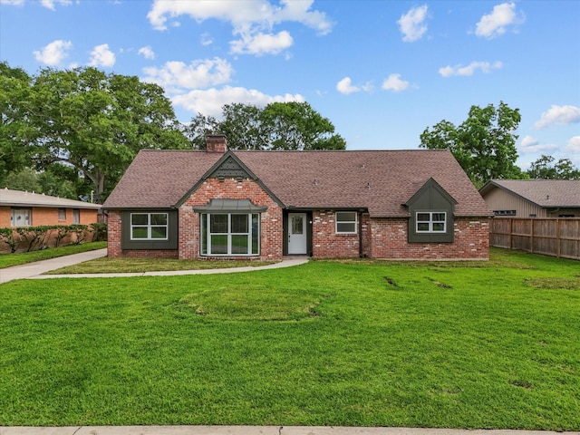 110 Harborcrest Dr, Taylor Lake Village, TX 77586 - view of front facade featuring brick siding, a shingled roof, and a chimney