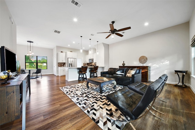 3148 Poe Dr, Montgomery, TX 77356 - living area featuring dark wood-type flooring, ceiling fan, recessed lighting, and baseboards