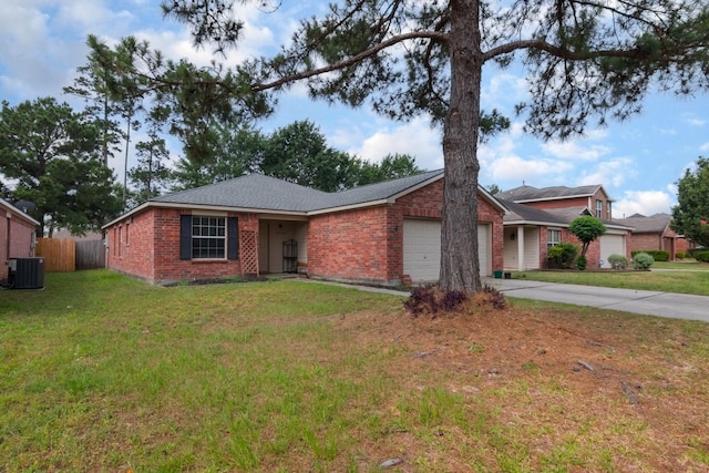 24027 Pinecreek Pt, Spring, TX 77373 - ranch-style home featuring central AC unit, a garage, concrete driveway, and brick siding