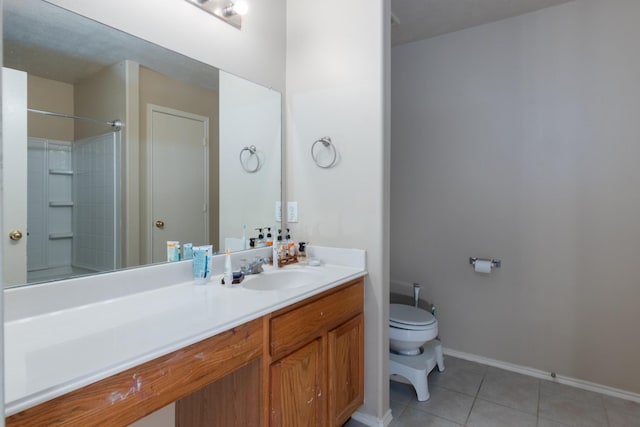 24027 Pinecreek Pt, Spring, TX 77373 - bathroom featuring toilet, tile patterned floors, vanity, baseboards, and a shower