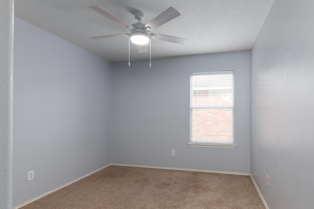 24027 Pinecreek Pt, Spring, TX 77373 - empty room featuring carpet floors, ceiling fan, and baseboards
