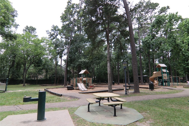 9003 Gaylord Dr Unit 11, Houston, TX 77024 - communal playground featuring a yard and view of scattered trees