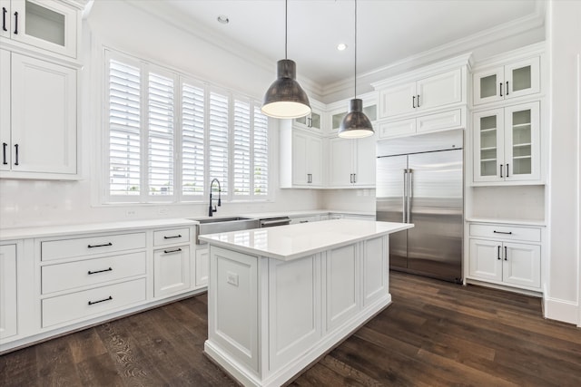 3850 Glen Arbor Dr, Houston, TX 77025 - kitchen featuring stainless steel built in fridge, a sink, white cabinets, ornamental molding, and dark wood-style floors