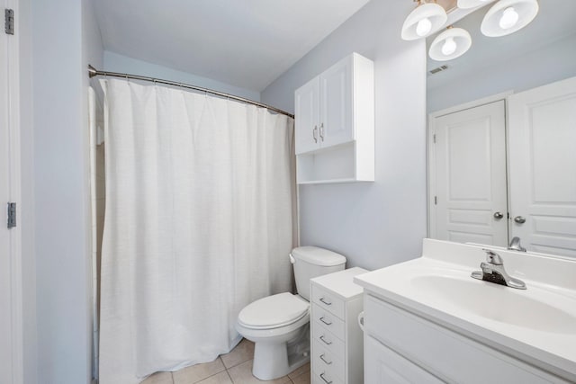 1725 Harvey Mitchell Pkwy S Unit 2433, College Station, TX 77840 - full bathroom with vanity, toilet, tile patterned floors, and a shower with shower curtain