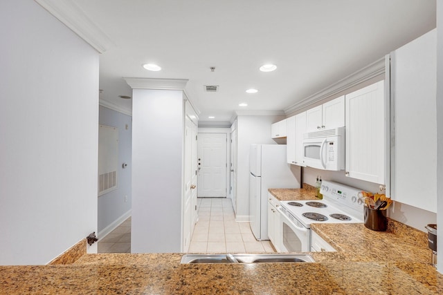 1725 Harvey Mitchell Pkwy S Unit 2433, College Station, TX 77840 - kitchen with white appliances, light tile patterned floors, ornamental molding, white cabinetry, and baseboards