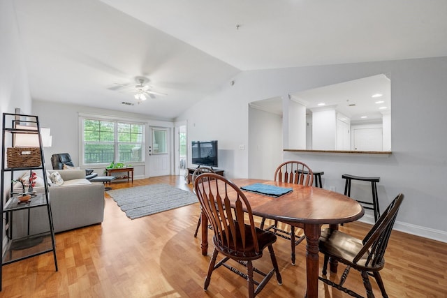 1725 Harvey Mitchell Pkwy S Unit 2433, College Station, TX 77840 - dining area featuring vaulted ceiling, a ceiling fan, light wood-style flooring, and baseboards
