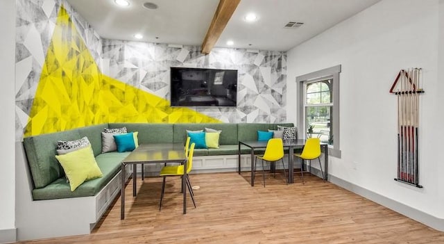 1725 Harvey Mitchell Pkwy S Unit 2433, College Station, TX 77840 - living room featuring wood finished floors, recessed lighting, beamed ceiling, an accent wall, and baseboards