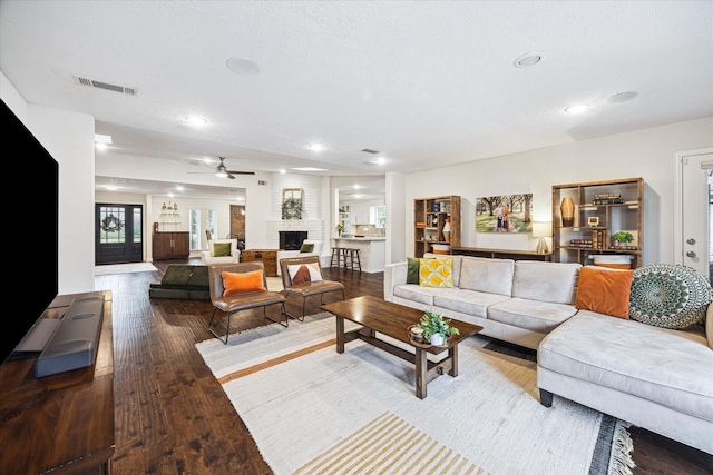2714 Fontana Dr, Houston, TX 77043 - living room featuring wood finished floors, recessed lighting, ceiling fan, and a brick fireplace
