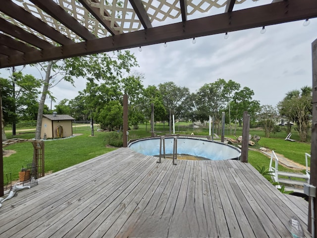 182 Smith Rd, Palacios, TX 77465 - deck with a pergola, a lawn, and an empty pool