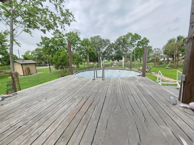 182 Smith Rd, Palacios, TX 77465 - wooden deck with a yard and an outdoor pool