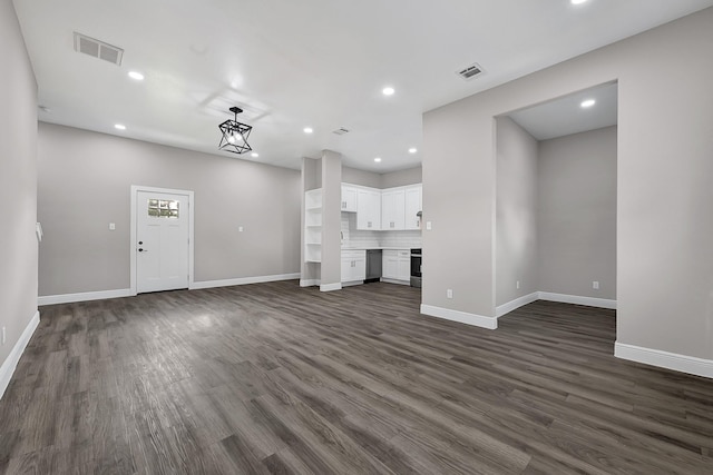 9805 Fabiola Dr, Houston, TX 77075 - unfurnished living room with recessed lighting, dark wood-type flooring, and baseboards