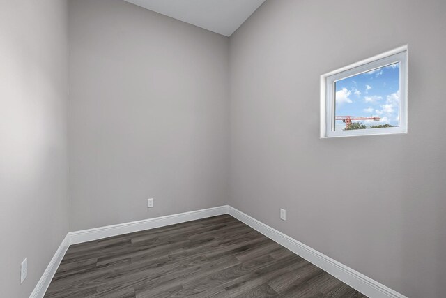 9805 Fabiola Dr, Houston, TX 77075 - spare room with dark wood-type flooring and baseboards