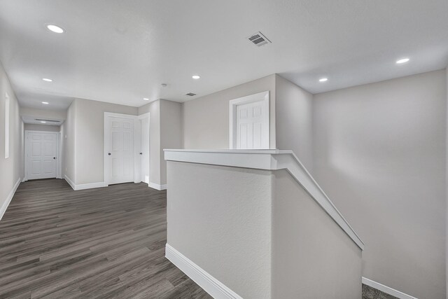 9805 Fabiola Dr, Houston, TX 77075 - hallway featuring an upstairs landing, baseboards, recessed lighting, and dark wood-type flooring