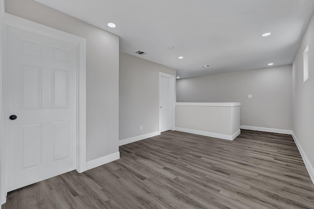 9805 Fabiola Dr, Houston, TX 77075 - unfurnished room with wood finished floors, baseboards, and recessed lighting