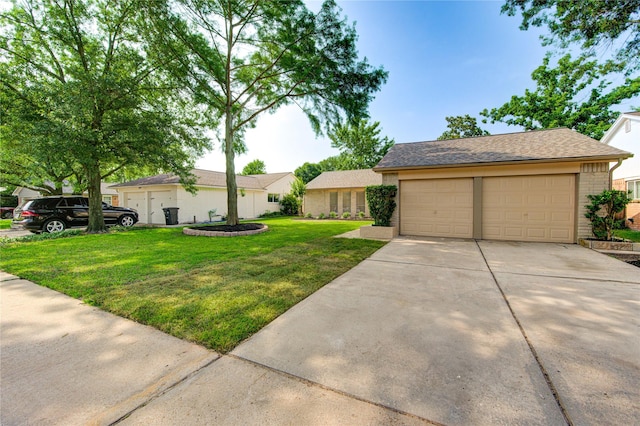 14011 Dominique Dr, Cypress, TX 77429 - view of front of house with a front lawn, brick siding, and a detached garage