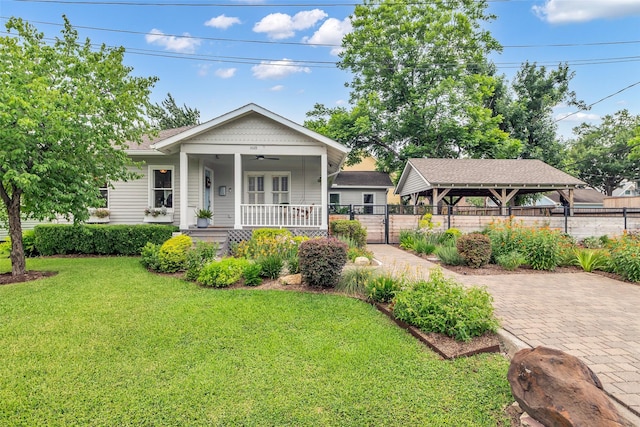 1618 Lawrence St, Houston, TX 77008 - view of front facade featuring a ceiling fan, covered porch, a gazebo, and a gate