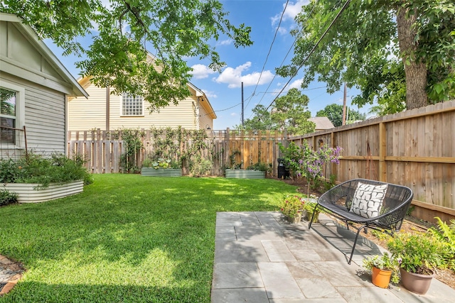 1618 Lawrence St, Houston, TX 77008 - view of yard with a vegetable garden and a patio