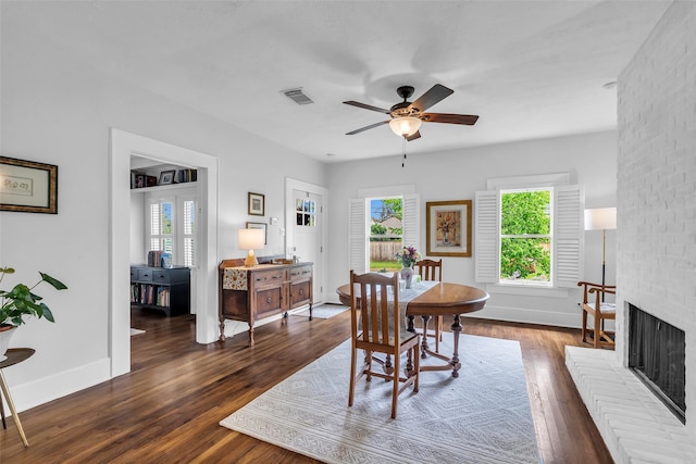 1618 Lawrence St, Houston, TX 77008 - dining area featuring ceiling fan, healthy amount of natural light, dark wood-style floors, and baseboards