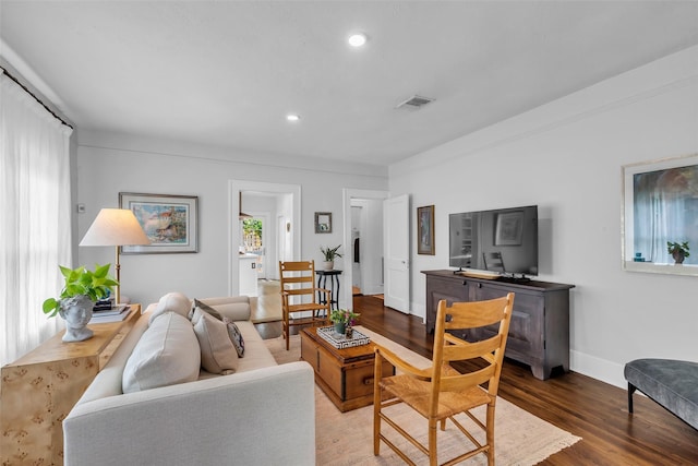 1618 Lawrence St, Houston, TX 77008 - living room featuring wood finished floors, baseboards, and recessed lighting