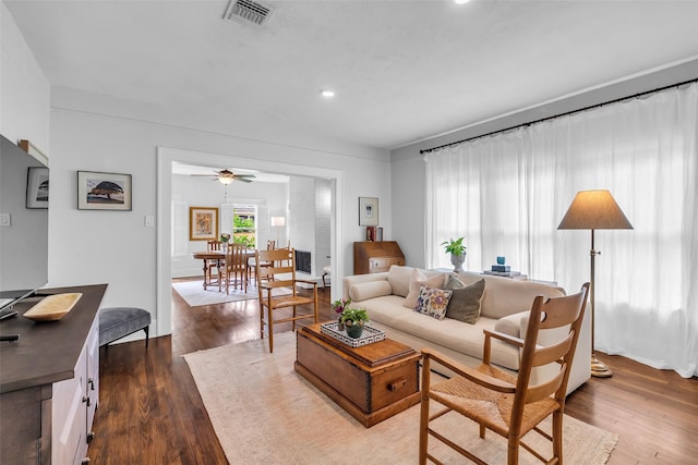 1618 Lawrence St, Houston, TX 77008 - living room with dark wood-style flooring, ceiling fan, and recessed lighting