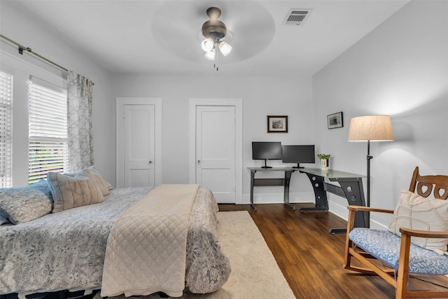 1618 Lawrence St, Houston, TX 77008 - bedroom with wood finished floors, an office area, baseboards, and a ceiling fan