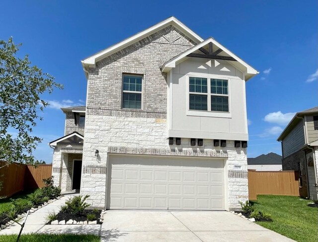 1108 Greenshank Dr, Katy, TX 77493 - view of front facade featuring stone siding, a garage, and driveway
