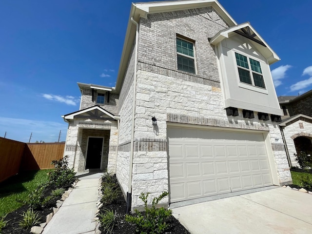 1108 Greenshank Dr, Katy, TX 77493 - view of front of home featuring stone siding, a garage, and driveway