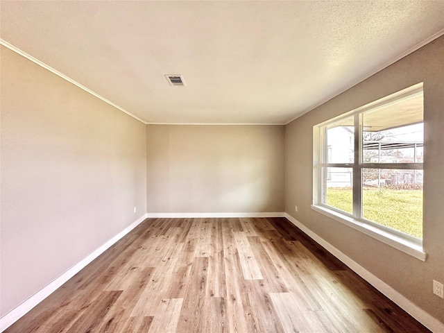 7845 Bonaire St, Houston, TX 77028 - unfurnished room featuring wood finished floors, baseboards, and ornamental molding