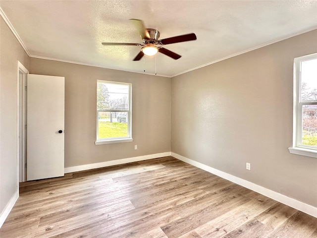 7845 Bonaire St, Houston, TX 77028 - spare room with ceiling fan, wood finished floors, ornamental molding, and baseboards