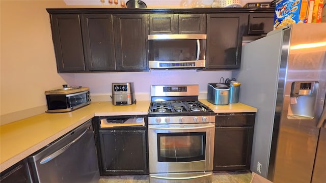 19726 Imperial Colony Ln, Katy, TX 77449 - kitchen featuring stainless steel appliances, light countertops, and dark brown cabinets