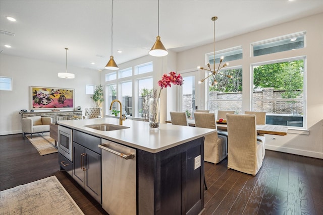 3116 Somerset Levens Ln, Houston, TX 77055 - kitchen with a sink, dark wood-type flooring, baseboards, appliances with stainless steel finishes, and light countertops