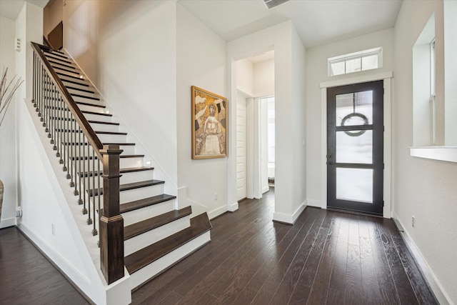 3116 Somerset Levens Ln, Houston, TX 77055 - entrance foyer featuring stairs, dark wood-style flooring, and baseboards