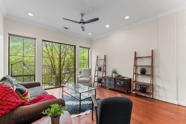 118 Mcgowen St Unit E, Houston, TX 77006 - living room featuring healthy amount of natural light, a ceiling fan, wood finished floors, recessed lighting, and ornamental molding