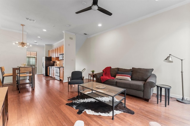 118 Mcgowen St Unit E, Houston, TX 77006 - living room featuring a ceiling fan, crown molding, recessed lighting, wood finished floors, and baseboards