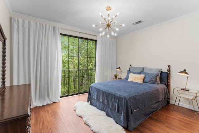 118 Mcgowen St Unit E, Houston, TX 77006 - bedroom with a chandelier, crown molding, wood finished floors, and access to outside