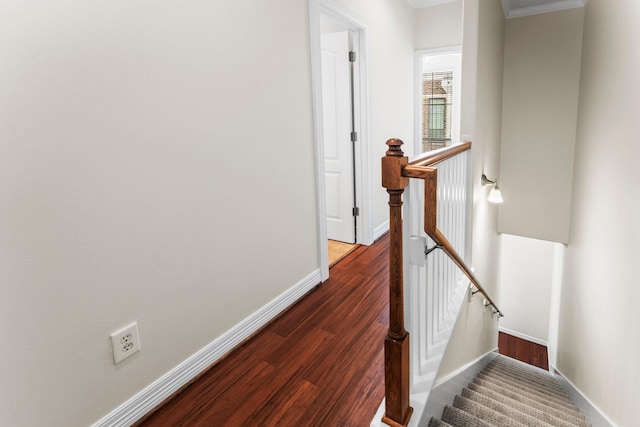 118 Mcgowen St Unit E, Houston, TX 77006 - stairway featuring baseboards, wood finished floors, and ornamental molding