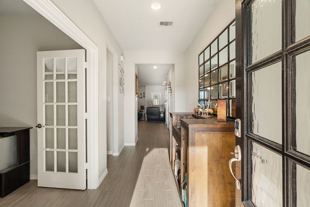 8219 Delta Down Dr, Fulshear, TX 77441 - hall with wood finished floors, baseboards, and recessed lighting