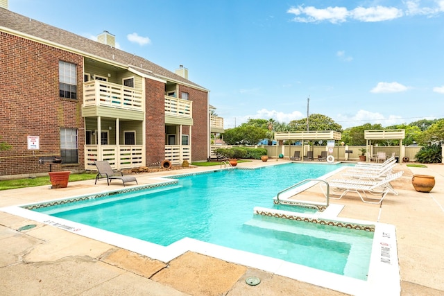 500 Ferry Rd Unit 434D, Galveston, TX 77550 - community pool featuring a patio and a hot tub