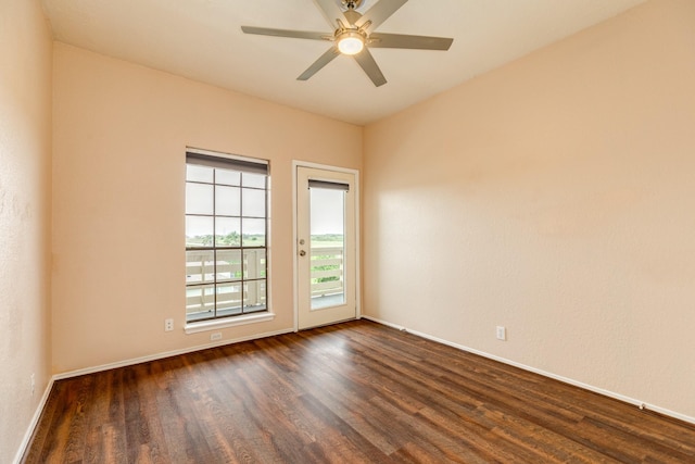 500 Ferry Rd Unit 434D, Galveston, TX 77550 - spare room featuring dark wood finished floors, baseboards, and ceiling fan