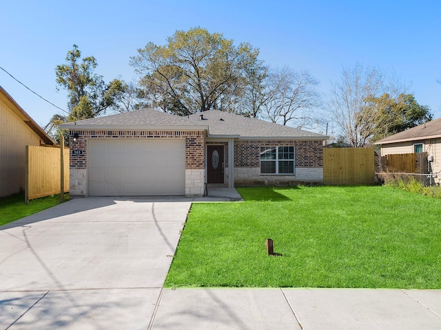 305 E Humble St, Baytown, TX 77520 - view of front of house with a garage, roof with shingles, driveway, brick siding, and stone siding