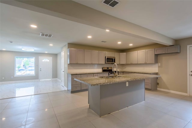 126 Red Ripple Rd, Houston, TX 77076 - kitchen with appliances with stainless steel finishes, gray cabinets, light stone counters, baseboards, and recessed lighting