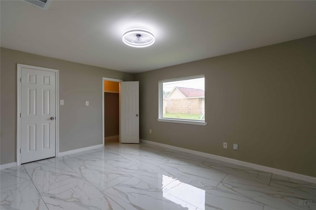 126 Red Ripple Rd, Houston, TX 77076 - unfurnished bedroom featuring light marble finish flooring and baseboards