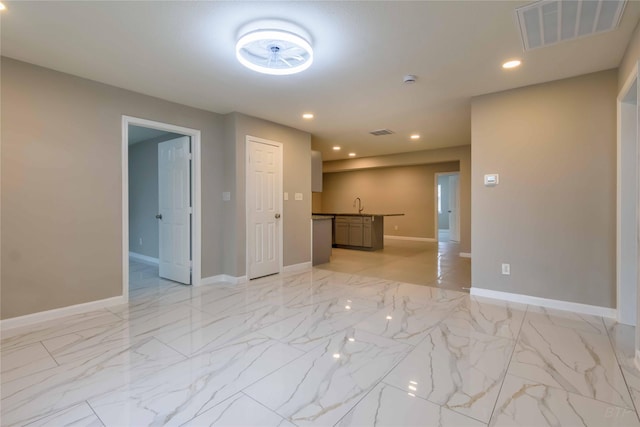 126 Red Ripple Rd, Houston, TX 77076 - unfurnished room with recessed lighting, light marble finish flooring, baseboards, and a sink