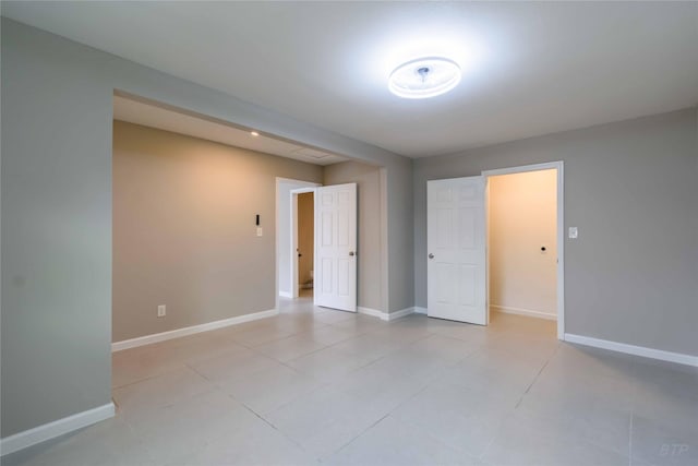 126 Red Ripple Rd, Houston, TX 77076 - spare room featuring baseboards and light tile patterned floors