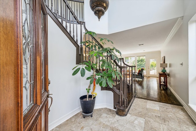 1202 Marconi St, Houston, TX 77019 - foyer entrance featuring stairs, ornamental molding, and baseboards