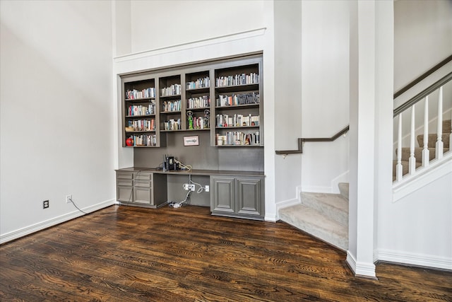 1202 Marconi St, Houston, TX 77019 - unfurnished office featuring built in study area, dark wood-style floors, and baseboards