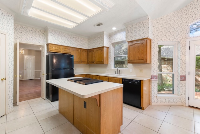 127 S Copperknoll Cir, The Woodlands, TX 77381 - kitchen with black appliances, wallpapered walls, light tile patterned flooring, a sink, and light countertops