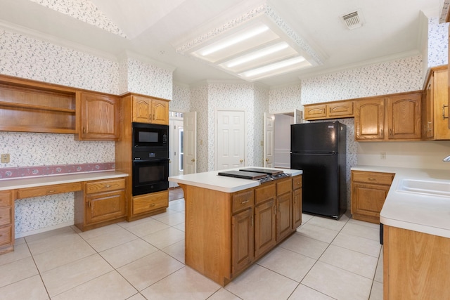 127 S Copperknoll Cir, The Woodlands, TX 77381 - kitchen with black appliances, wallpapered walls, a sink, light countertops, and a center island
